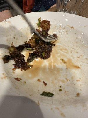 What was left after just a few minutes of the fried Brussels sprouts going down on the table...