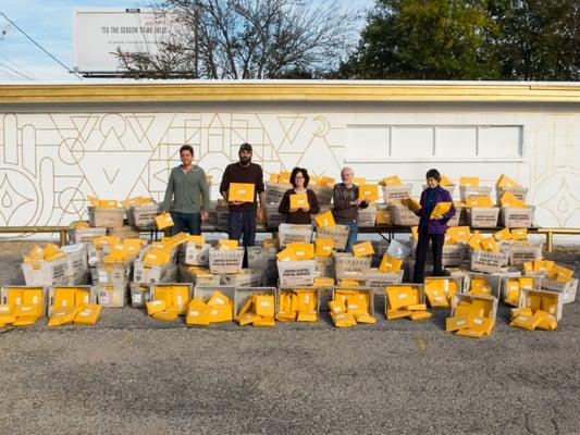 Our volunteers with packages of free books ready to be sent to inmates in Texas.