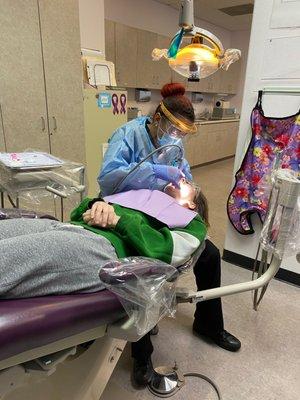 Dental Assistant performing Coronal Polish