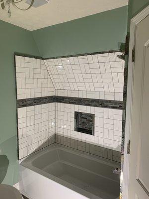 New bathroom tiled bathtub surround