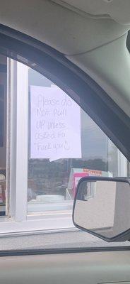 Sign in the Dunkin drive-through telling you not to pull up and less they tell you to.