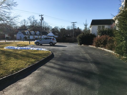 Ample parking with entrances on Elm Street and Railroad Street