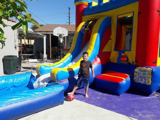 My nephew was so happy to have the water slide for the day