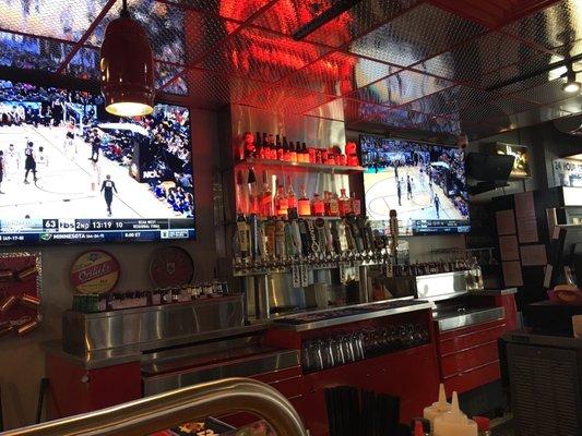 14 massive TVs can be seen from most seats at the bar