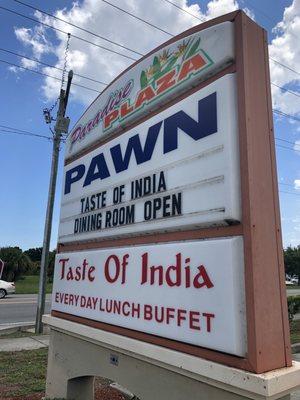 The Paradise Plaza and Paradise Pawn Shop sign.