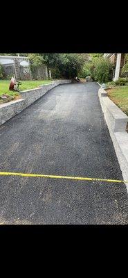 New asphalt driveway and retaining walls