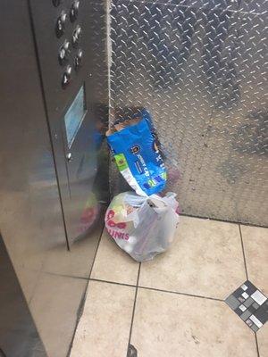 Trash inside elevator