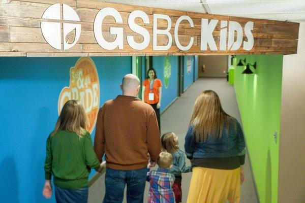 Our kids classrooms are located in our bright blue and green kids' hallway