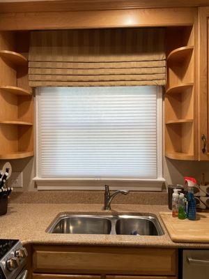 New shades and valences above kitchen sink.