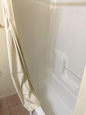 I moved the shower curtain; everything was spotless.