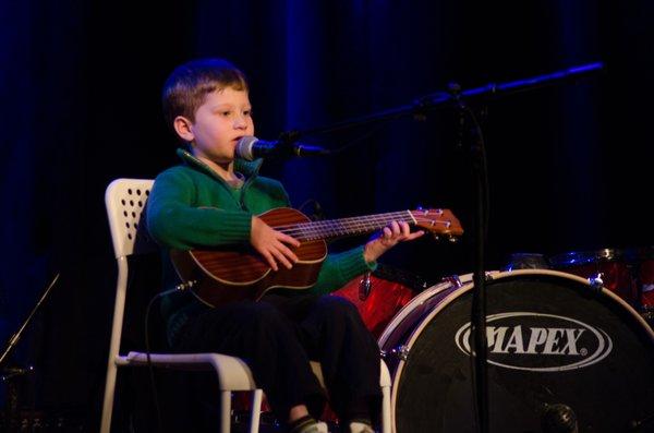 One of our ukulele students playing and singing at our Winter Recital