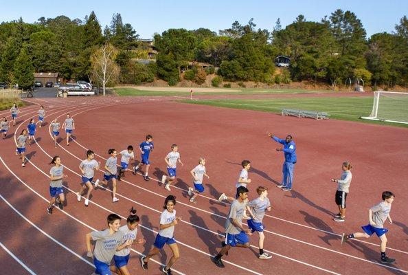 Middle School physical education class on track and field.