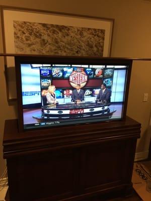 50" Samsung 4K Ultra HD TV mounted in a custom automated lift.