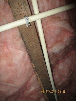 The tiny holes in this floor joist are a sign of wood destroying inscects called powder post beetles.