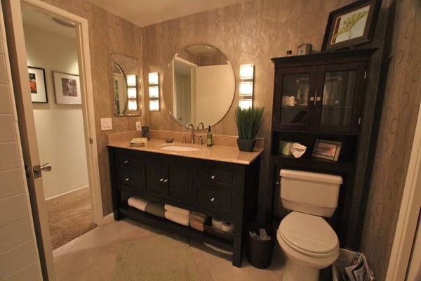 Master bath renovation.  Reduce glare and shadows by adding wall lighting.