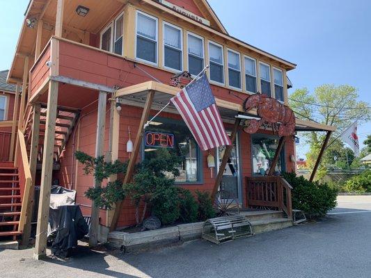 On a corner inside this classic gem with apartments above. Three picnic benches outside to eat.