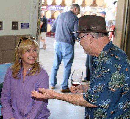 A wine club member enjoys chatting with Darcie at a Wine Club Release Party