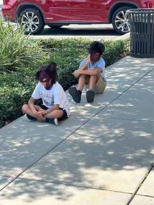 My kids having to sit outside because the store only allowing one person at a time.