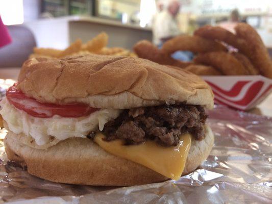 Cheeseburger with Cherryville classic toppings of tomato, slaw and pickle