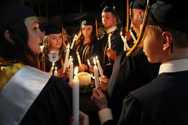 Candle lighting ceremony during graduation.