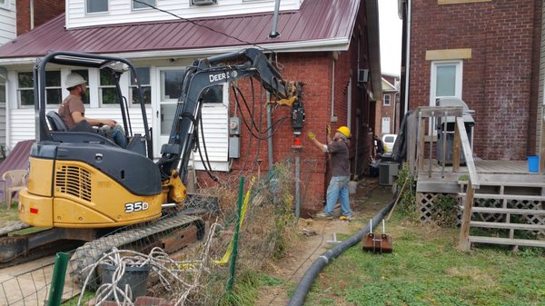 Install helical piers to repair foundation, over 25 feet deep for this one.