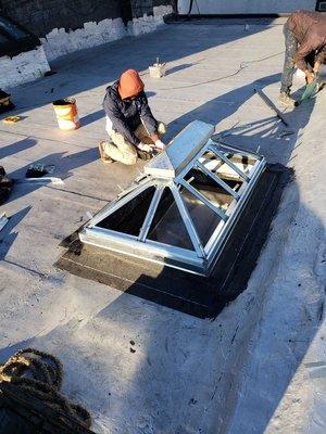 Installing custom made skylight.