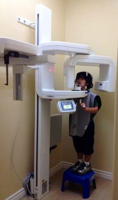 Noah Phillips taking dental  x-rays. The machine rotates around the patients head. No more ouchie film x-ray:)