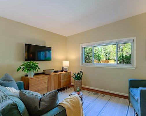 After handling the water damage in the ceiling, we refinished the drywall and repainted the rooms to bring a light, airy feel indoors.