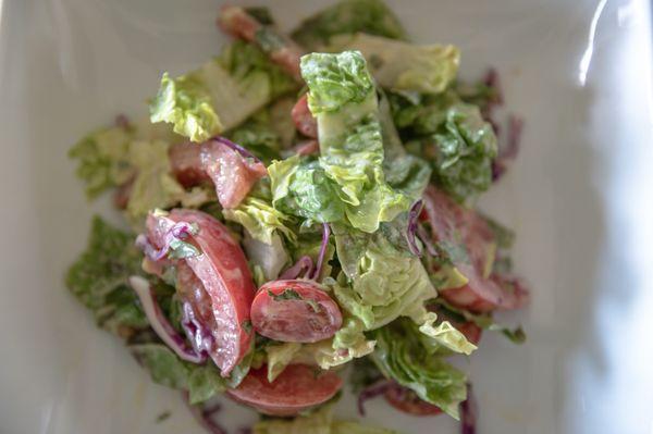 Romaine, tomato, red cabbage and fresh herb salad, creamy aged red wine vinaigrette