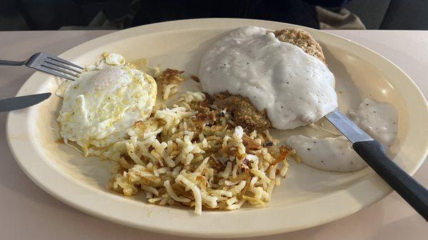 Country fried steak and eggs.