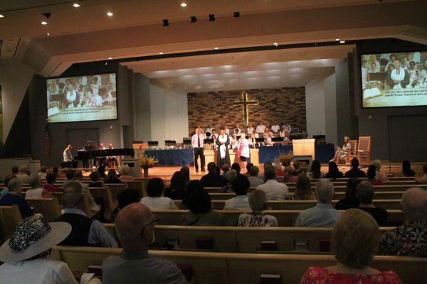 Pastor David passes the baton to Pastor Sharon.