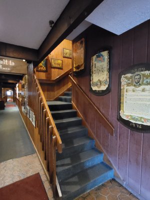 Classic wood paneling decor dating back to the late 70s  stairway leading up to the upper levels