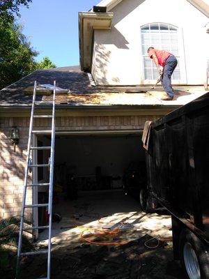 2nd Home: 
 Roofer removing deck where tree branch fell into home.