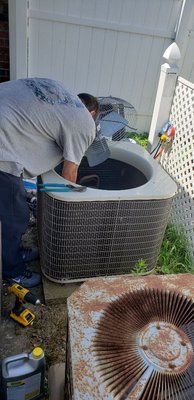 Tightening connections inside the condenser.