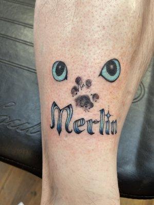 My fiancé's memorial tattoo of Merlin. Merlin's paw print. Done by Kato Green at Meow Meow.