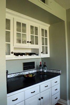 White Dove cabinetry and soapstone backsplash in bar/dinette area of the kitchen.