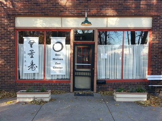 The Zen Center is housed between two store fronts. Parking is to the south (to the left, as you face the building).