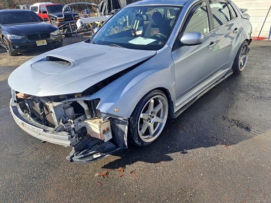 Hood repaired and painted, new front bumper replaced and installed