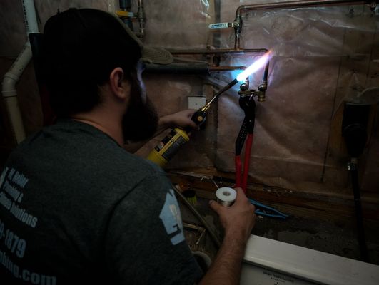 Matt in dark with blowtorch