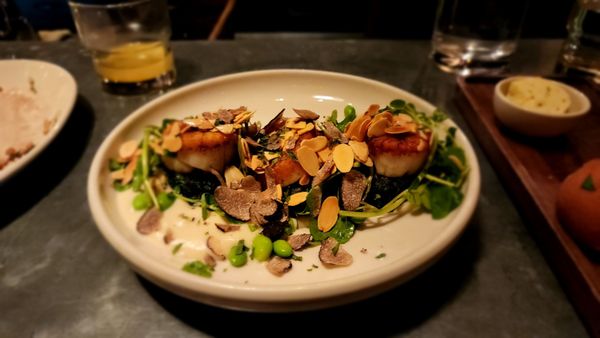 Pan Seared Scallops Island greens pancake, cauliflower purée, edamame, watercress, lemon vinaigrette, shaved almonds, black truffle