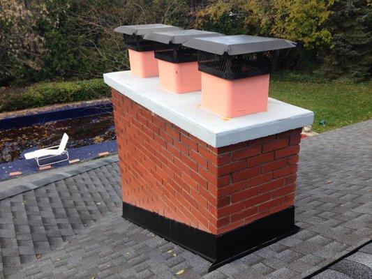 A new roof flashing and poured concrete chimney cap