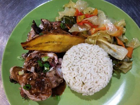 Jerk Chicken with White Rice, Cabbage and Plantain.