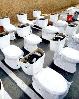 A group of Naigara Stealth toilets ready for install.