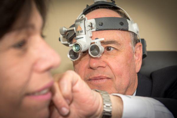 Dr. Wilks looking thru our binocular scope