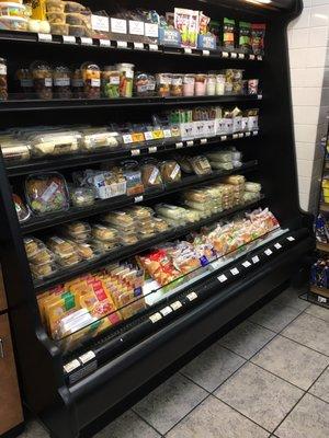 A selection of packaged sandwiches and fresh foods.