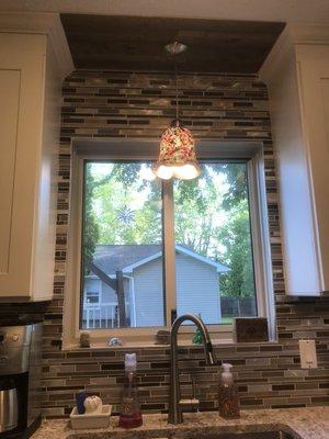 Backsplash tile installation.