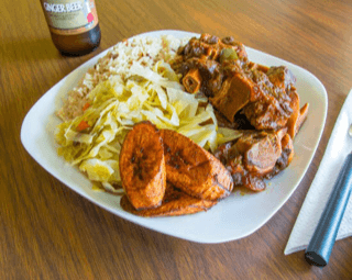 Oxtail, rice and peas and cabbage.