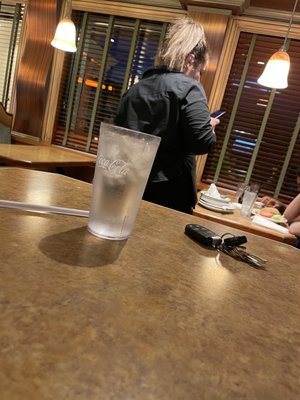 Waitress hanging with her friends at another table. "They say America is this great thing but it's actually pretty shitty"