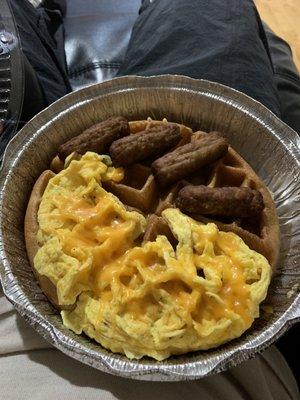 Waffles, eggs with cheese, and sausage