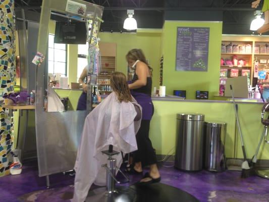 Note stylist on the phone cradled under her ear DURING my daughter's haircut.